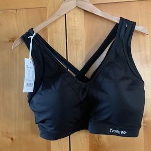 Yvette, black, sports bra, criss cross straps in the back. Hook & eye closure.